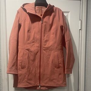 Women's Lululemon Repelshell Coral Hooded Rain Jacket.  Color - coral